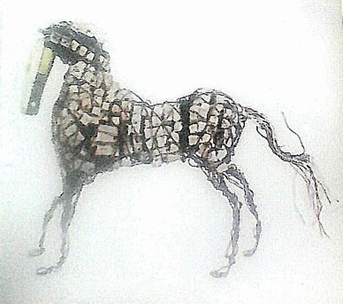 Standing horse built from wire and pale bottle caps
