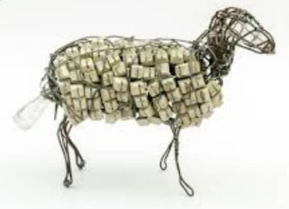 Standing sheep with a fleece of pale bottle caps