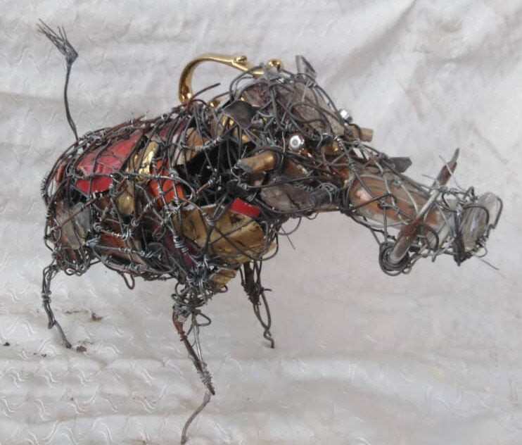 Warthog built from wire, bottle caps and brass tusks
